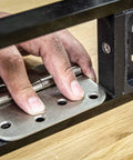 All-In-One Adjustable Door Hinge Jig Installation Kit For 2 Ft 6 In To 9 Ft Doors close-up of hinge fitting in jig