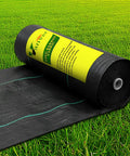 Alt Tag: Heavy Duty Weed Barrier Landscape Fabric 2.8 Ft By 50 Ft Ground Cover, black woven cloth roll on grass