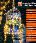 Rechargeable 33Ft 100LED Copper Wire String Lights With Timer And 13 Modes illuminating a birdcage with plants at night