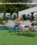 Two Person Hammock With Adjustable Steel Stand And Pillow For Easy Outdoor Lounging, Heavy Duty Portable Set, Handles Up To 450 Lbs, Perfect For Patio Garden Beach Backyard Camping And Chill Sessions, showing couple relaxing by pool