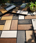 Durable Wood Plastic Composite Patio Deck Tiles With Interlocking Design For 3D Random Pattern DIY Floor Tiles outdoors in sunlight.