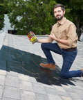Man applying Heavy Duty Rubberized Waterproof Tape For Patching Leaks And Sealing Repairs That Works Underwater on roof.