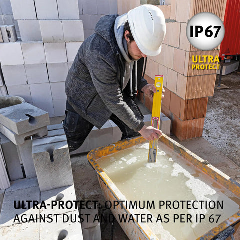 Kickass Heavy Duty Yellow Digital Spirit Level With Blazing Illuminated Readouts being used on construction site for precision squaring.