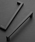 20 Pack 7-1/2 Inch Square Kitchen Cabinet Handles Matte Black Pulls For Cupboard And Drawer - top view on dark background