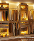 Real Game Changing Modular Closet System Set Of Two Expands From Six To Ten Feet Wide With Six Wooden Drawers Ten Sturdy Rods Built In LED Glass Shelves And Two Pants Bars For Bedroom Storage That Is Built Different And Just Works - illuminated closet with hanging clothes and wooden drawers.