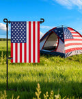 Heavy Duty Garden Flag Stand With Collapsible Steel Holder Pole Weatherproof Coating And Locking Spring Clips For Top Tier Outdoor Decor Without The Flag Hassle Free Setup Yard Ready Gear displaying an American flag near a tent.