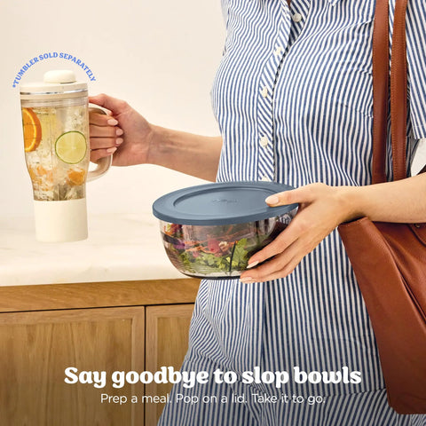 Five In One Food Prep And Storage Bowl System With Crinkle Slicing Shredding Functions dual bowl held by a woman.
