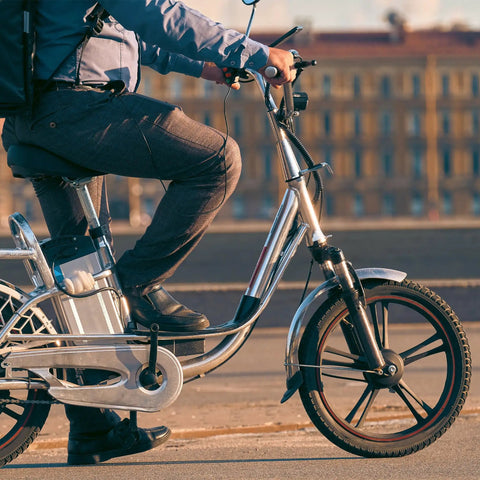 Man riding electric bike with two pack bike tubes with bent valve for electric bikes kids bikes and electric scooters made from butyl rubber