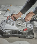 Person using the Rock Solid Heavy Lifter 20V Compact Circular Saw Kit on tiles with precision cutting for renovation.