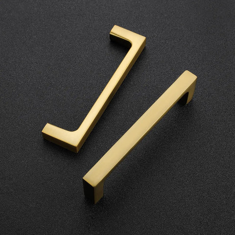 30 Pack Solid 3-3/4 Inch Square Kitchen Cabinet Handles Brushed Brass Drawer Pulls on black surface