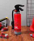 Realistic Water Squirt Fire Extinguisher Toy For Kids Pretend Play Durable Plastic standing on wooden surface with toy cars.