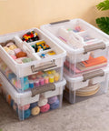 17 Quart Clear Plastic Storage Bins With Four Compartment Removable Tray, stackable latching box shown filled with crafts and tools