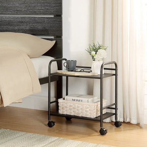 Zero Hassle Two Tier Metal Rolling Cart With Smooth Gliding Casters Slides Into Tight Corners Like A Dream Built Tough For Versatile Under Desk Storage Anywhere beside a bed with a coffee cup and flowers.