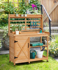 Large Outdoor Potting Bench With Storage Cabinet And Shelf Planting Console For Patio Lawn Garden Pro Grade Fir Wood Workstation Built To Last Durable Finish And Easy Assembly on grass with garden tools and potted plants