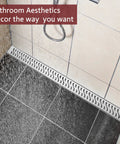 Transform Your Bathroom Game With This Rock Solid 24 Inch Linear Shower Drain Featuring A Brushed Nickel Finish And Serious Flow Capability For Quick Drain Action, installed in a shower with water flowing over it.