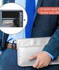 Person holding Fireproof Document Bag 2000F Waterproof And Fireproof Money Bag, shown fitting into a safe, ideal for office use.