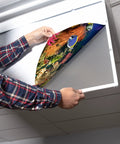 Installing fluorescent light covers for 2x4 ceiling lights in classrooms to cut glare and eye strain with easy on the eyes light
