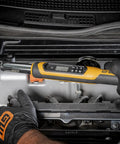 Mechanic using Three Eighth Inch Drive Electronic Torque Wrench With Target Torque Alert Vibrating Handle Buzzer And LED Indicates When Target Is Reached 7.4 To 99.6 Ft Lb Range Includes Multiple Units Ft Lb In Lb Nm Kg M Kg Cm For Precise Auto And Bike Maintenance Be on engine bolts