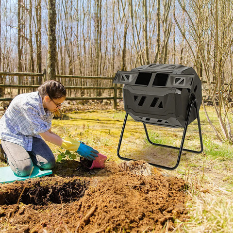 43 Gallon Outdoor Compost Bin With Dual Chamber Tumbler, 360 Degree Spin, Two Sliding Doors, Gloves Included in garden setting