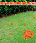 20 Pack 5 Inch Low Profile Survey Markers High Visibility Orange Yard Stakes spread on lawn for precise lot marking