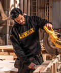 Man using saw wearing Men's Carrier Hoodie Black Pullover Sweatshirt With Front Pockets, Durable PolyCotton Blend