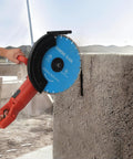 Badass 3000W 14 Inch Electric Concrete Saw With Built In Water Pump cutting through concrete with diamond blade.