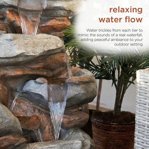 Close-up of 40-Inch Four Tier Rock Floor Fountain With Cascading Water And White LED Lights, indoor setting