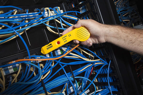 Hand using Heavy Duty Wire Tracer And Cable Tester Kit With Alligator Clips RJ11 And RJ45 Connectors in server room