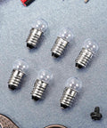 20 Pack Real Deal E10 Miniature Screw Light Bulbs 2.5V 0.3A Tiny Replacement Warm Glow for Toy Cars and Circuit Models Rock Solid E10 Socket Mini Bulb Haul with visible glass and metal designs.