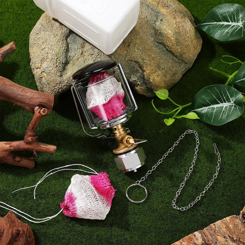 Rugged Portable Propane Lamp For Outdoor Camping With Copper And Stainless Steel Construction and accessories on grass