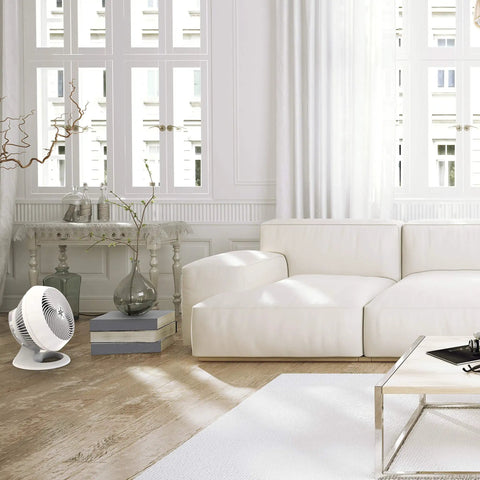 Slip Into Cool Vibes With Slick White Whole Room Air Circulator Fan in a bright living room setting.