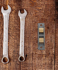Upgrade Your Sliding Door Game Today With These Heavy Duty Stainless Steel Double Wheel Track Rollers and tools on wood background.