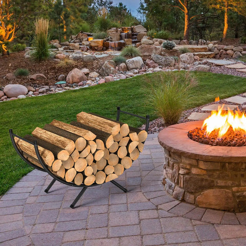 Beefy Heavy Duty Curved Firewood Rack 33 Inch Steel Log Holder by a fire pit in a backyard setting