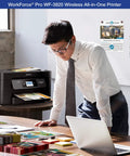 Workforce Pro WF-3820 Wireless All-in-One Printer on desk with man reviewing documents, showcasing auto 2-sided printing feature.