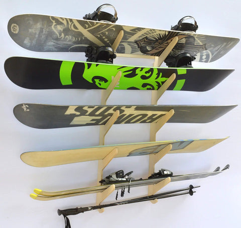 Premium Wall Rack Mount For Ski Snowboard And Longboard Storage Featuring Adjustable Baltic Birch Arms Heavy Duty Gear Holder Holds Up To One Hundred Twenty Pounds with skis and snowboards displayed.