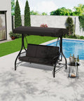 Three-Seat Outdoor Porch Swing With Adjustable Canopy For Sun Protection, Sturdy 800 Lb Heavy Duty Steel Frame, Reclines To A 180 Degree Swing Bed, Cup Holder Trays, Cushions And Pillows For Garden, Black, by a poolside.