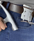 Person using Built To Last Stainless Steel Hammer Holster For Tool Belts, 2.6 Inch Hammer Loop, Drill Holder Clip on jeans