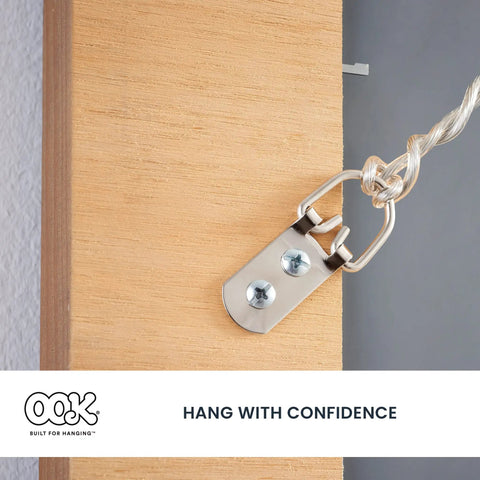 Heavy Duty D Ring Hangers For Mirrors And Picture Frames 10 Pack Zinc Plated Steel mount attached to wooden frame with cable