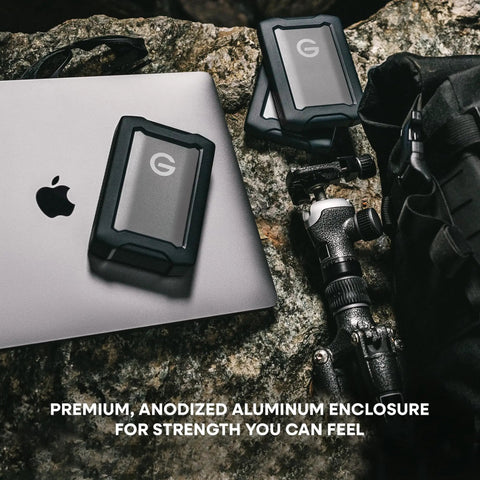 G Drive ArmorATD 5TB Rugged Portable External Hard Drive USB C 5Gbps USB 3.2 Gen 1 on a laptop and camera setup outdoors
