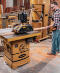 Heavy Duty 5 HP Spindle Shaper With Cast Iron Base And Digital Readout For Zero Error Cutting Includes Micro Adjust Fence And 30 X 40 Table With 3 Phase Motor For Pro Shop Applications Requiring Rock Solid Reliability in a woodworking setting.