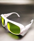 Pro Level Rugged Laser Safety Goggles With Universal EP Replacement Lenses For UV And Fiber Laser Protection, white frame, green lenses.