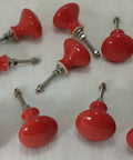 10 Pack Hand Painted Ceramic Cabinet Knobs Bold Drawer Pulls With Heavy Duty Mounting Hardware No Sweat Setup For Kitchen Cupboards Home Offices And Bathrooms displayed from above, featuring red ceramic knobs with screws.