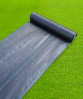 Heavy Duty Weed Barrier Landscape Fabric 3ft X 100ft 3.2oz Woven Garden Cloth on lawn, roll partially unrolled