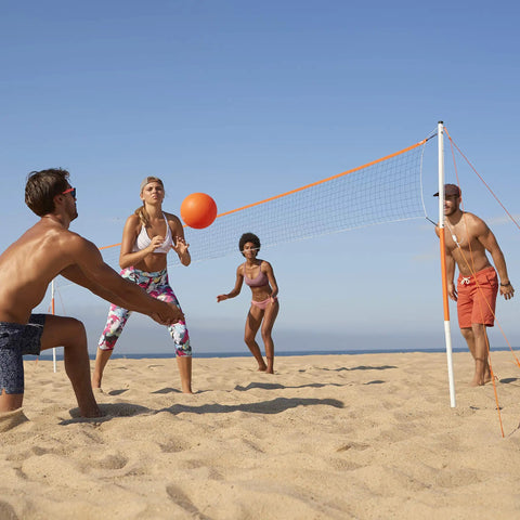 People playing volleyball with Go To Backyard Volleyball Kit For Ultimate Family Fun Easy Setup Portable Outdoor Recreation Gear.