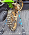 Motorbike secured with Two Pack Truck Bed Anchor Kit for Tailgate, rugged polyester webbing anchoring it on pickup bed rails.