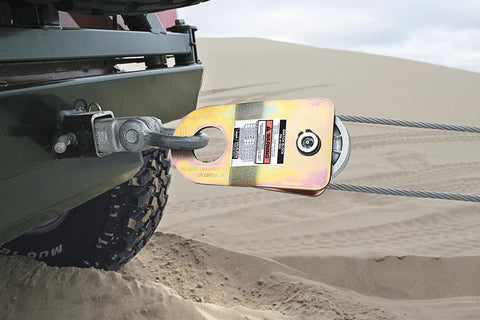 Beefed Up Snatch Block 19000 Lbs with Grease Port used in off-road vehicle winching setup on sandy terrain
