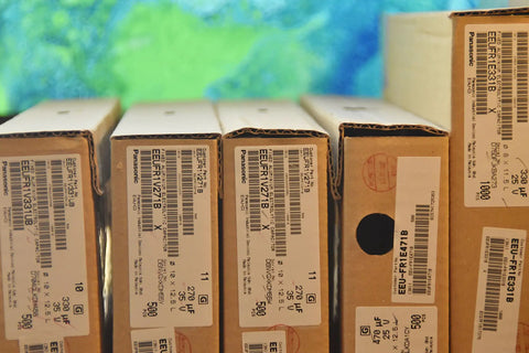 Top Shelf Low Impedance Electrolytic Capacitors 1000 Uf 35 Volt Bulk Pack on shelves, including various sizes and labels.