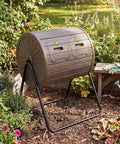 Dual Chamber Compost Bin With 360 Degree Rotating Tumbler 37.5 Gallon Outdoor Bin On Sturdy Metal Stand Lockable Doors BPA Free Plastic Ideal For Kitchen Garden And Yard Waste in garden setting