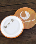 Back view of a round pin badge from the DIY 58mm Button Maker Machine Kit with 1000 Button Blanks and Circle Cutter Included, shown on wood surface.