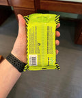 Person holding a pack of To Go Tech Wipes 25 Count Skin Safe Electronics Cleaning Wipes For Screens Phones Tablets Laptops Keyboards Monitors